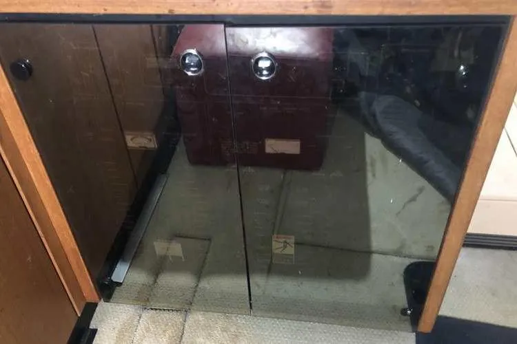 Slide: The Image of Glass cabinet doors inside a 1997 Bayliner 3988 Motoryacht interior. - 29