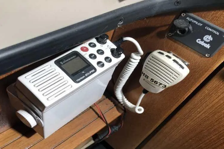 Slide: The Image of VHF radio and autopilot control on 1997 Bayliner 3988 Motoryacht dashboard. - 32