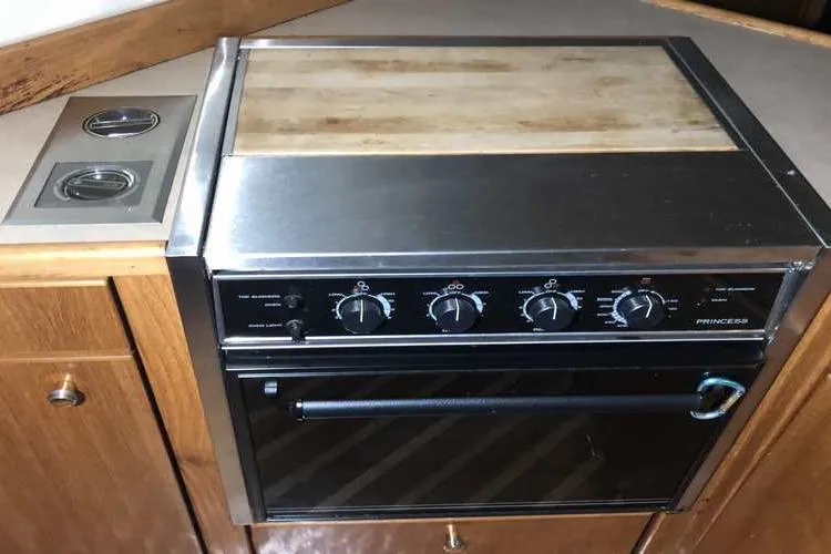 Slide: The Image of Stove and oven in 1997 Bayliner 3988 Motoryacht kitchen area. - 34