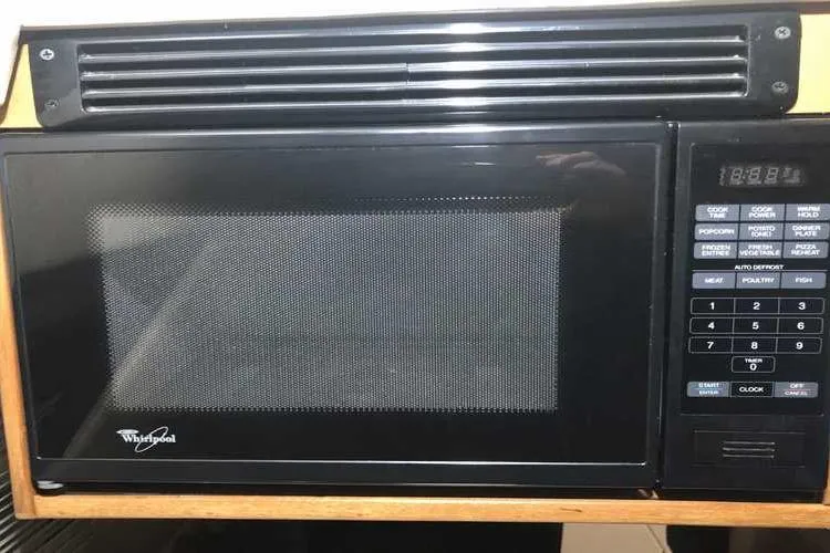 Slide: The Image of Whirlpool microwave in 1997 Bayliner 3988 Motoryacht kitchen area. - 37