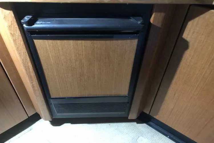 Slide: The Image of 1997 Bayliner 3988 Motoryacht interior with wooden cabinetry and built-in refrigerator. - 38