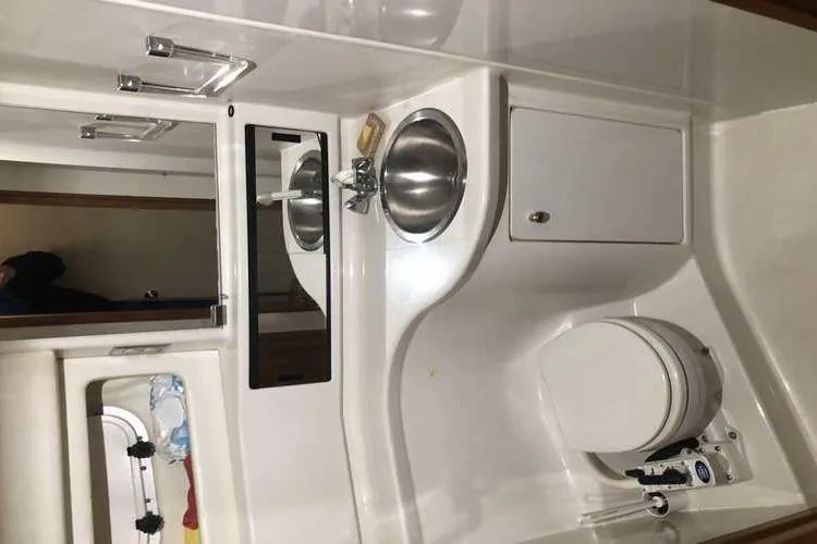 Slide: The Image of Bathroom interior of 1997 Bayliner 3988 Motoryacht with sink and toilet. - 47