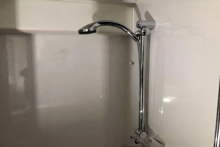 Slide: The Image of Shower fixture in 1997 Bayliner 3988 Motoryacht bathroom, featuring sleek chrome design. - 53