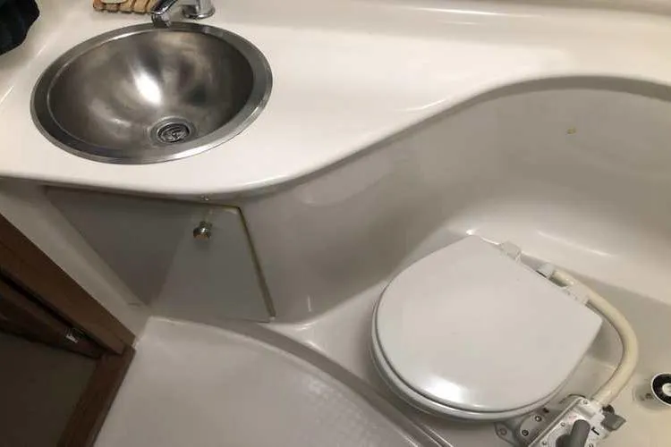 Slide: The Image of Bathroom interior of 1997 Bayliner 3988 Motoryacht with sink and toilet. - 56