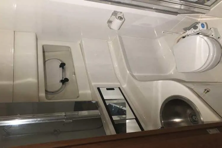 Slide: The Image of Bathroom interior of 1997 Bayliner 3988 Motoryacht with toilet and sink. - 59