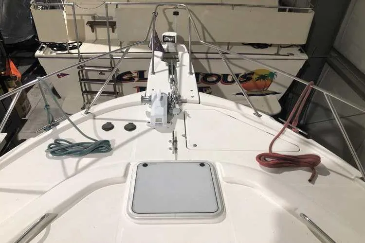 Slide: The Image of 1997 Bayliner 3988 Motoryacht deck with ropes and anchor equipment. - 7