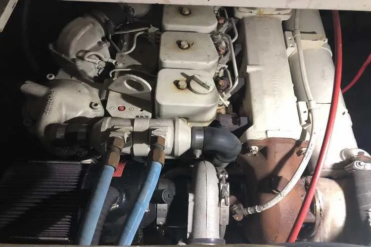 Slide: The Image of Engine compartment of a 1997 Bayliner 3988 Motoryacht, showcasing mechanical components. - 82