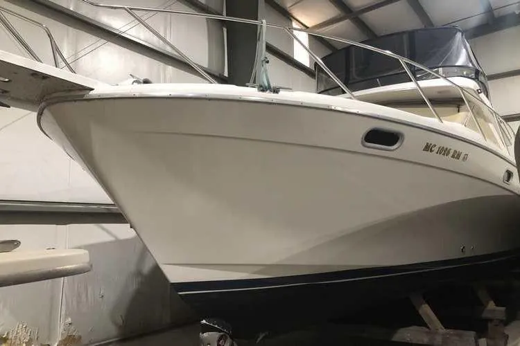 Slide: The Image of 1997 Bayliner 3988 Motoryacht in indoor storage, showcasing sleek design and sturdy build. - 9