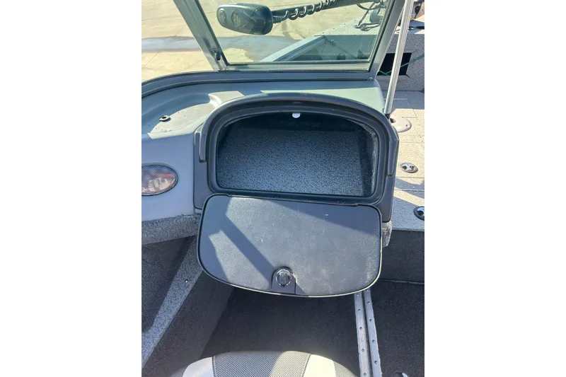 Slide: The Image of 2013 Lund 1800 Sport Angler boat interior storage compartment open. - 13