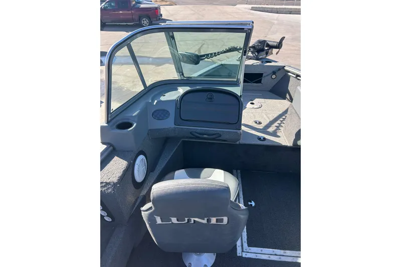 Slide: The Image of 2013 Lund 1800 Sport Angler boat interior with seating and windshield. - 17