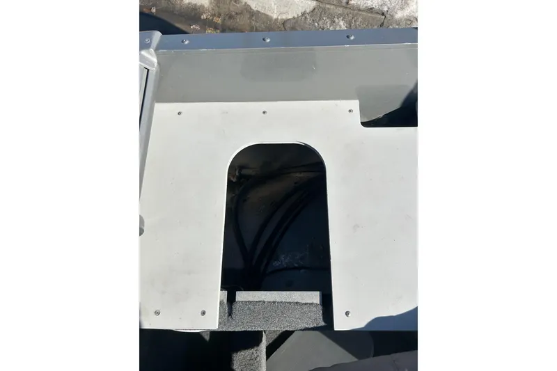 Slide: The Image of 2013 Lund 1800 Sport Angler boat interior with visible wiring and panel. - 19