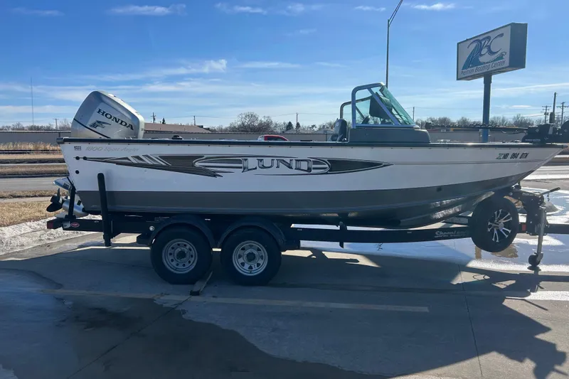 Slide: The Image of 2013 Lund 1800 Sport Angler boat on trailer with Honda outboard motor. - 4