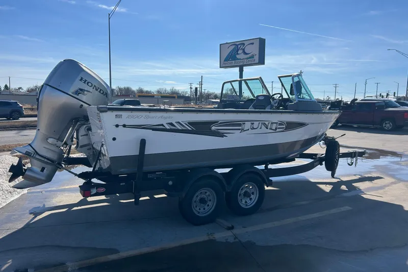 Slide: The Image of 2013 Lund 1800 Sport Angler boat on trailer with Honda outboard motor. - 5