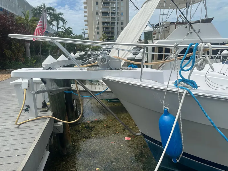 Slide: The Image of 1999 Mainship 430 Trawler docked, featuring bow details and marina setting. - 22