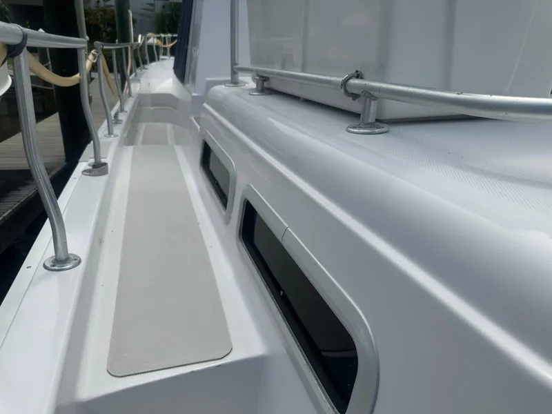 Slide: The Image of 1999 Mainship 430 Trawler deck with railing and non-slip surface. - 7