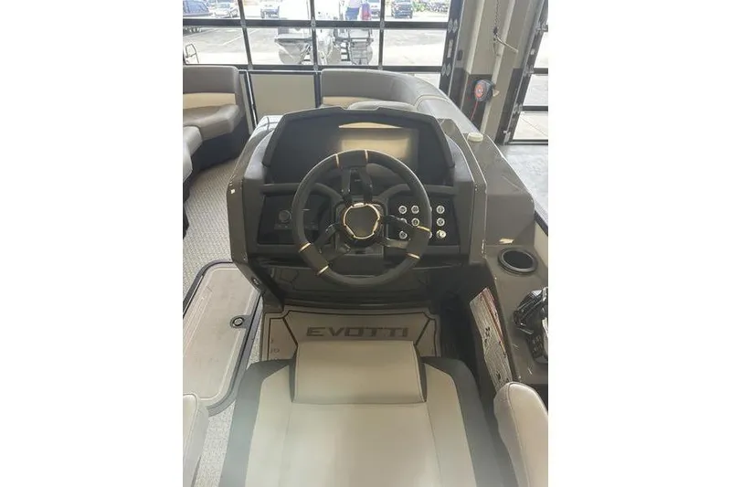 Slide: The Image of 2026 Evotti 723QL boat interior with modern steering console and seating. - 14