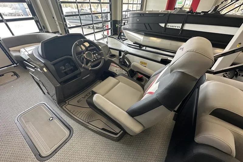 Slide: The Image of Interior of 2026 Evotti 723QL boat with modern steering and seating. - 17