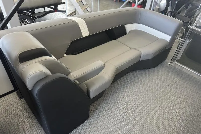 Slide: The Image of Gray and black seating in a 2026 Evotti 723QL boat interior. - 19