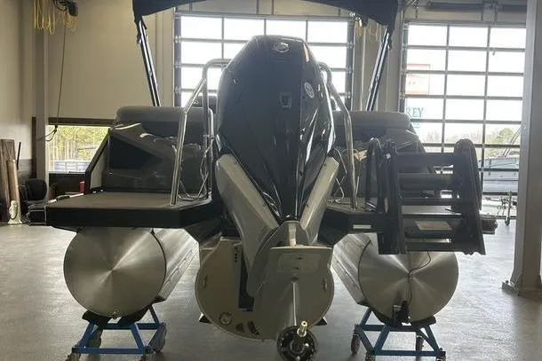 Slide: The Image of 2026 Evotti 723QL pontoon boat displayed indoors on wheeled stands. - 3