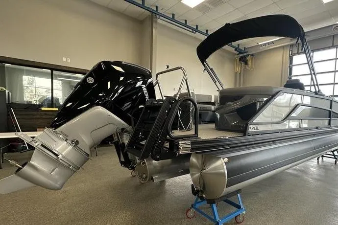 Slide: The Image of 2026 Evotti 723QL pontoon boat with powerful outboard motor in showroom. - 6