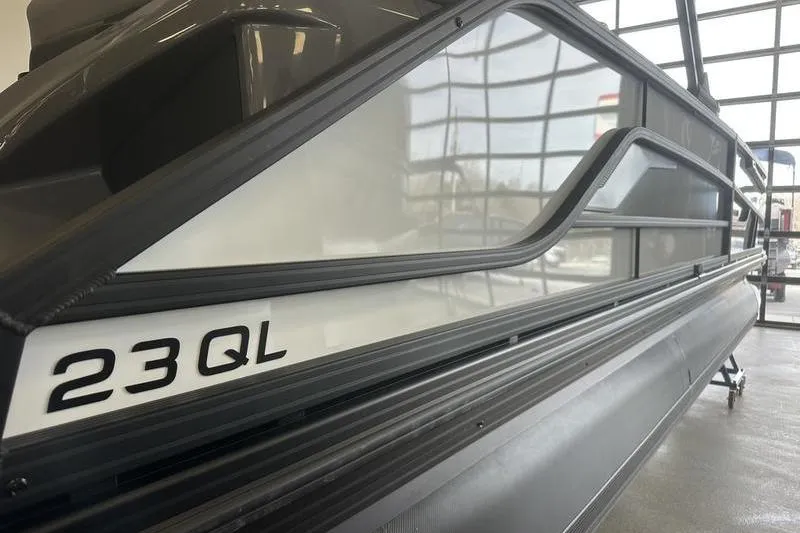 Slide: The Image of 2026 Evotti 723QL boat side view in showroom with modern design. - 9