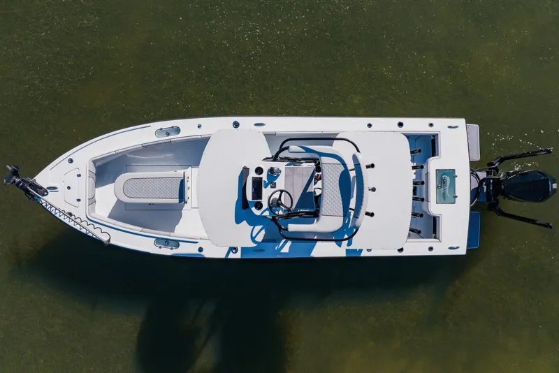 Slide: The Image of Overhead view of 2024 Dorado 25 boat on calm water. - 20