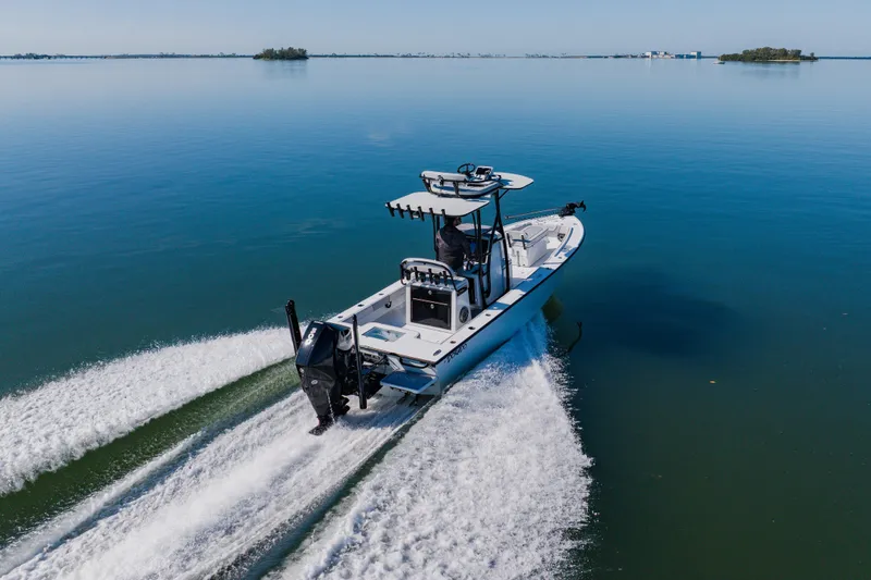 Slide: The Image of 2024 Dorado 25 boat cruising on calm water, showcasing sleek design and powerful performance. - 22