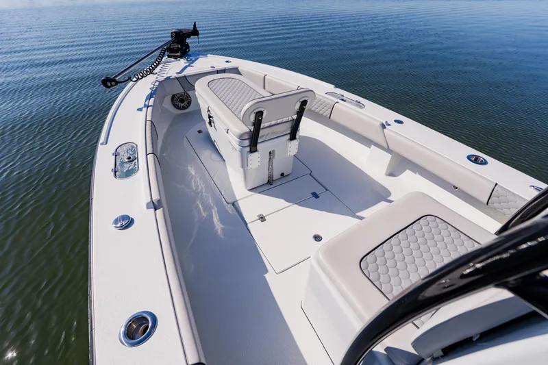 Slide: The Image of 2024 Dorado 25 boat interior with seating, on calm water. - 23