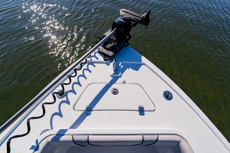 Slide: The Image of Bow of 2024 Dorado 25 boat with trolling motor on calm water. - 26