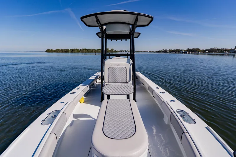 Slide: The Image of 2024 Dorado 25 boat on calm water, featuring sleek design and comfortable seating. - 28