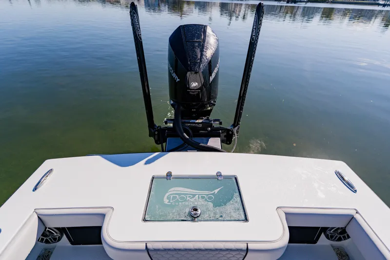 Slide: The Image of 2024 Dorado 25 boat with Mercury engine on calm water. - 39