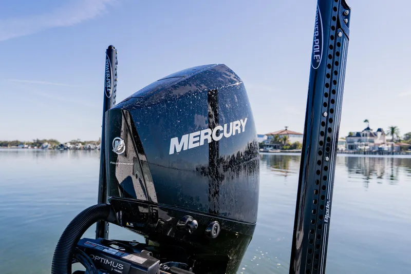 Slide: The Image of 2024 Dorado 25 boat with Mercury outboard motor on calm water. - 40