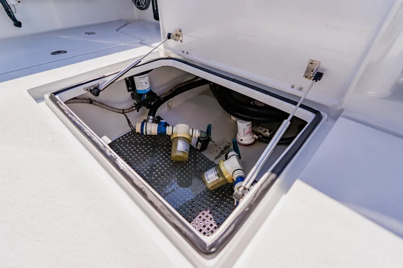 Slide: The Image of Open hatch of 2024 Dorado 25 boat showing internal components and wiring. - 42