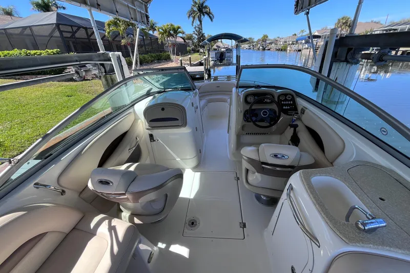 Slide: The Image of Interior of 2006 Chaparral 246 SSi boat with steering wheel and seating. - 11