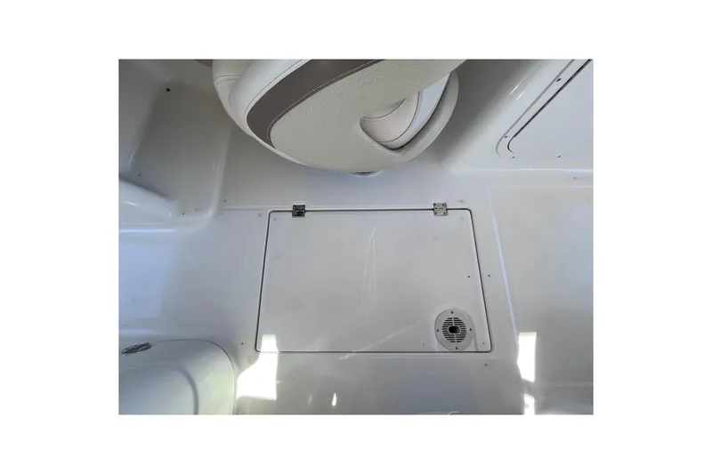 Slide: The Image of 2006 Chaparral 246 SSi boat interior with storage compartment and seat detail. - 22