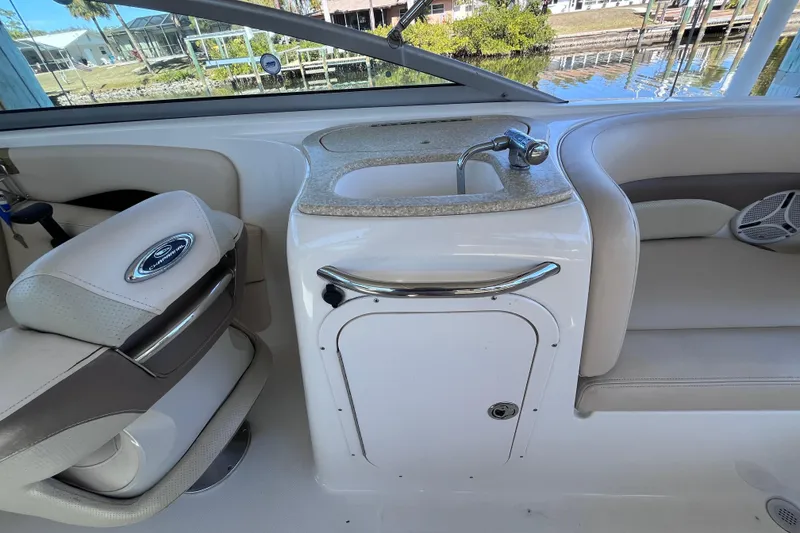 Slide: The Image of 2006 Chaparral 246 SSi boat interior with sink and seating area. - 24