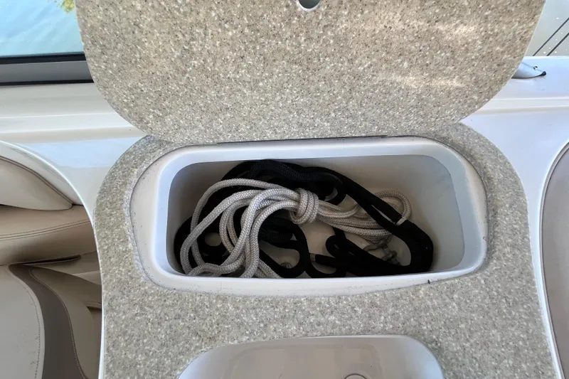 Slide: The Image of Storage compartment with ropes in a 2006 Chaparral 246 SSi boat. - 27
