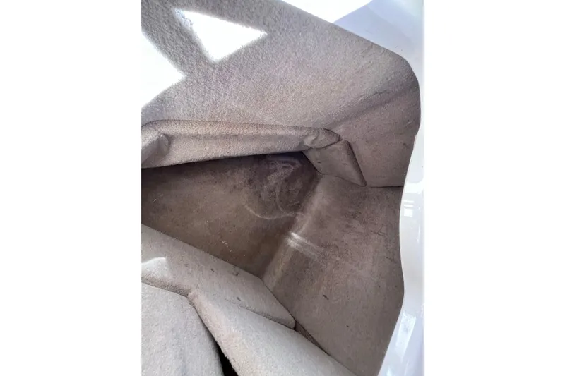 Slide: The Image of Interior view of a 2006 Chaparral 246 SSi boat storage compartment. - 32