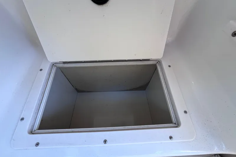 Slide: The Image of Open storage compartment in 2006 Chaparral 246 SSi boat. - 35