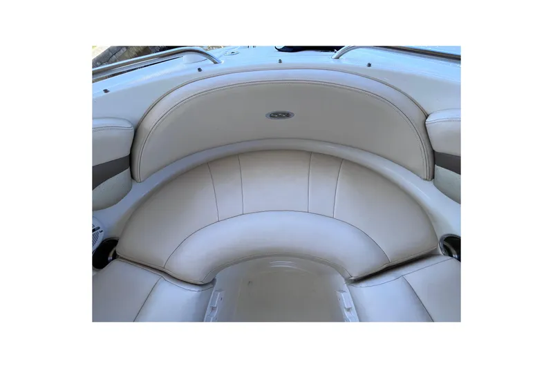 Slide: The Image of 2006 Chaparral 246 SSi boat interior with beige seating and cup holders. - 37