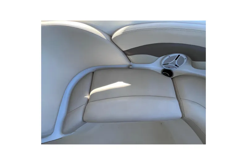 Slide: The Image of 2006 Chaparral 246 SSi boat interior with beige seating and built-in speaker. - 39