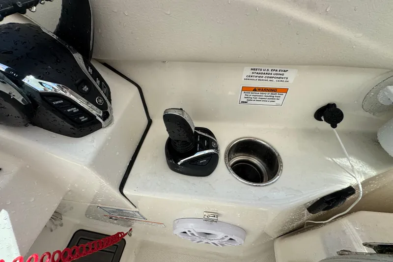 Slide: The Image of 2025 Sailfish 276 DC boat controls with joystick and warning labels. - 10