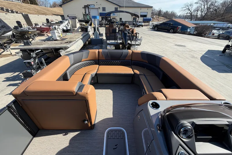 Slide: The Image of 2025 Sylvan L-3 SLZ pontoon boat with luxurious seating and modern design. - 4
