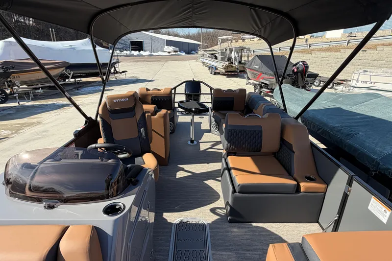 Slide: The Image of 2025 Sylvan L-3 SLZ pontoon boat with luxurious seating and modern design. - 5