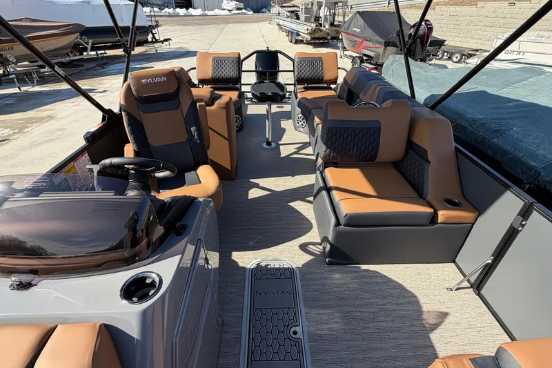 Slide: The Image of 2025 Sylvan L-3 SLZ pontoon boat interior with luxurious seating and modern design. - 8