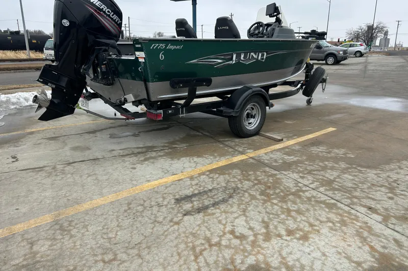 Slide: The Image of 2015 Lund 1775 Impact boat on trailer in parking lot. - 13