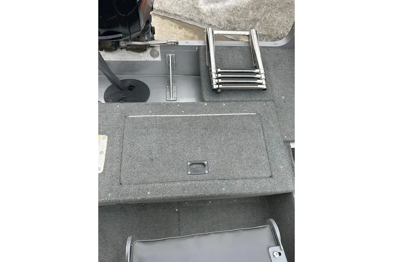 Slide: The Image of 2015 Lund 1775 Impact boat interior with folded ladder and storage compartment. - 16