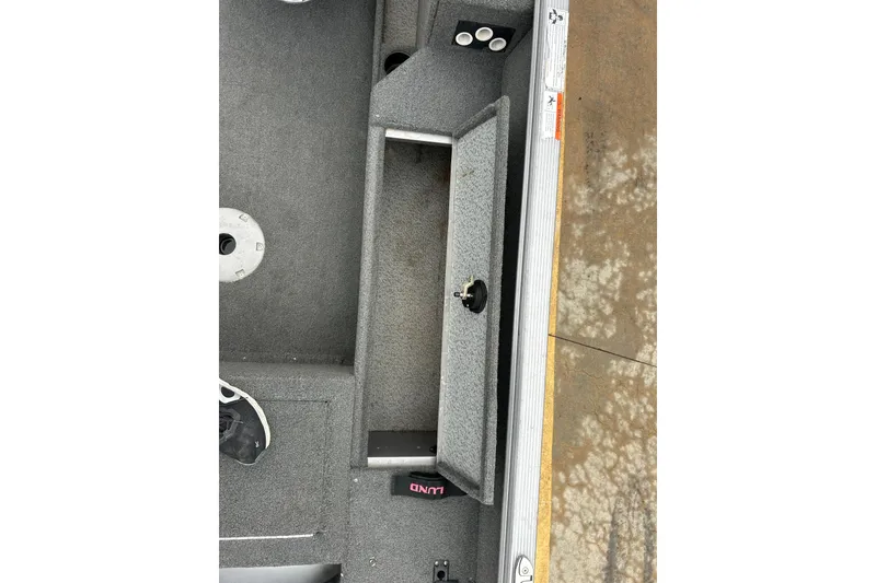 Slide: The Image of 2015 Lund 1775 Impact boat interior with open storage compartment. - 20