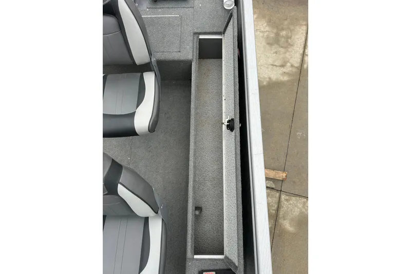 Slide: The Image of 2015 Lund 1775 Impact boat interior with open storage compartment and seating. - 21