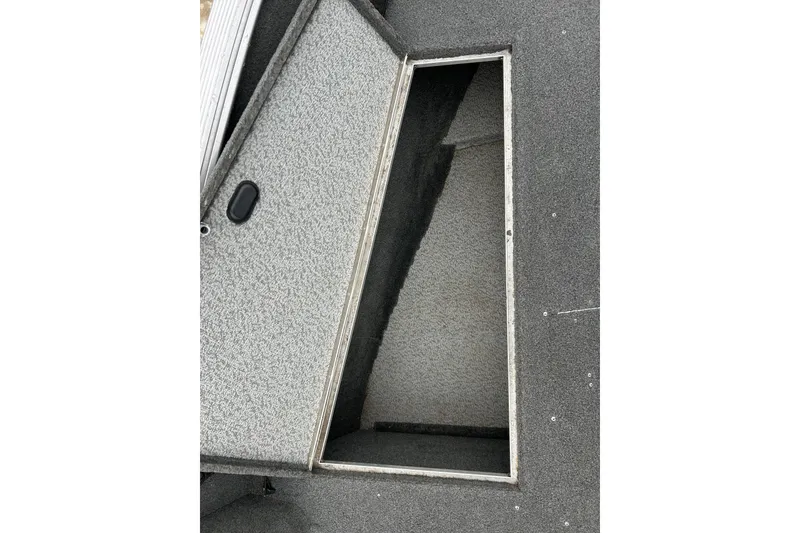 Slide: The Image of Open storage compartment on 2015 Lund 1775 Impact boat deck. - 23